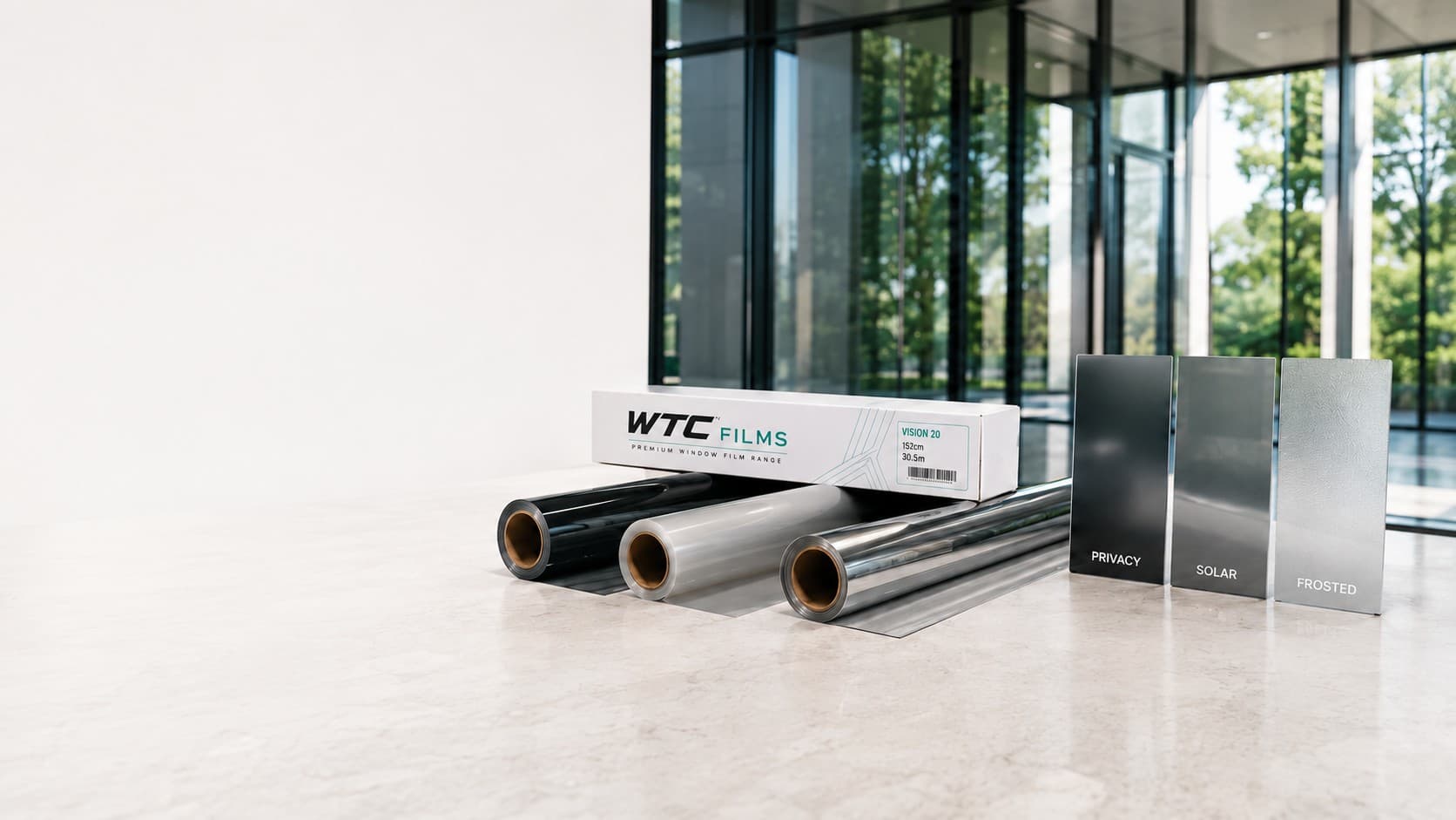 WTC Films window film rolls, sample panels and Vision 20 packaging in a bright modern interior